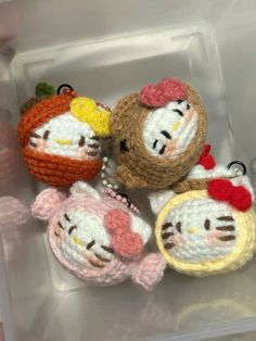 hello kitty crochet keychains in a plastic container