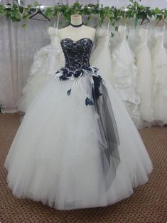 wedding dress on display in front of other dresses