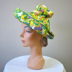 "Vintage 1960s chartreuse/acid yellow straw hat, with printed cotton brim and crown.  The crown is gathered at the top and is open on the top.  It has an upturned brim.  The hat is in good condition -- no holes; it has a few very faint, small spots.  The interior circumference is 21\", the brim is 3.25 - 4.5\" wide and the crown is 7\" tall. ---> If you need an order shipped by a particular date or shipped via a quicker method, please ask PRIOR to purchase to see if we can accommodate that reque Retro Fitted Hats For Spring, Retro Green Cotton Hat, Retro Fitted Hat For Spring, Green Retro Cotton Hat, Vintage Green Adjustable Hat, Spring Beach Sun Hat With High Crown, Retro Wide Brim Sun Hat For Summer, High Crown Sun Hat For Spring Beach, Retro Wide Brim Summer Hat