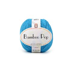 blue ball of yarn with the label bamboo pop on it, in front of a white background