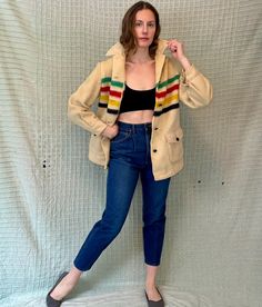 This vintage Hudson Bay coat is a classic addition to any wardrobe. The 4-point blanket design and art deco look make it a stylish choice for any occasion, whether it's a casual day out or a hunting/camping occasion. Made from 100% wool and crafted in Canada, this coat is of exceptional quality and will keep you warm and comfortable in any weather. The multi-color design and L/XL size make it a great choice for people of all ages and sizes. This original coat is not modified and is perfect for anyone looking for a vintage look. Era: 1950s/1960s Brand/maker: Hudson Bay Fabric content: 100% wool, unlined  Condition: excellent vintage condition with minor signs of wear. A few spots where the wool is not as fuzzy, particularly around the sleeves, and some faint dark marks under the buttons. No Hudson Bay, Blanket Coat, Blanket Designs, Vintage Looks, Color Design, Models, Favorite Outfit, Jackets & Coats, Ready To Wear