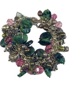 "This vitage bracelet is full of sterling silver from the base chain to the findings and sterling silver beads. It has crystals, and multiple colored pearls. There is also ruby zoisite oval stones through out the piece. The design is executed with great care and balance of color and shapes and sparkle. It is a treasure for whom ever it goes home too. 7 1/2\" long by 1 3/4\" wide. Gift Boxed." Sterling Silver Dangle Beaded Bracelets For Jewelry Making, Beaded Sterling Silver Bracelets, Green Sterling Silver Bracelets With Silver Beads, Green Sterling Silver Bracelet With Silver Beads, Silver Charm Bracelet With Gemstone Beads, Green Sterling Silver Beaded Bracelet, Artisan Czech Glass Jewelry Bracelet, Artisan Czech Glass Bracelet, Artisan Silver Beaded Bracelets With Gemstones