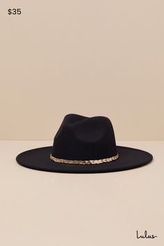 Western wear just got a little more chic, thanks to the Cowgirl Composure Black Felt Metal Band Western Hat! This iconic hat has a soft, felt composition that shapes the recognizable cowboy silhouette of a wide brim, a high collar, and a classic dipped crown. Gold-toned herringbone chain creates a chic braided band to complete the look. 3. 75" Soft Brim. 23" Interior Circumference. 90% Polyester, 10% Alloy. Imported. Lulus | Cowgirl Composure Black Felt Metal Band Western Hat. Fall Party Felt Hat With Short Brim, Chic Fedora With Short Brim For Country Events, Flat Brim Felt Hat For Fall Parties, Chic Flat Brim Hats For Country Events, Solid Color Party Hat For Fall, Chic Brimmed Felt Hat For Rodeo, Chic Wide Brim Felt Hat For Rodeo, Chic Felt Fedora For Rodeo, Black Fedora For Fall Country Events