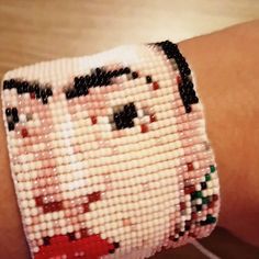 a close up of a person wearing a bracelet