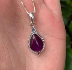 This listing is for one teardrop accent amethyst sterling silver pendant. Amethyst is a transparent to translucent stone that has a lavender to reddish violet hue. It is typically found with a clear to white translucent swirling pattern. It forms as crystals in geodes or in host stones. Amethyst translates from Greek to mean not intoxicated. Amethyst is a stone known to help prevent nightmares and alleviate headaches. This stone cleanses and purifies the emotions and helps rid the mind of negati Purple Teardrop Gemstones For Gift, Sterling Silver Teardrop Gemstones Gift, Amethyst Gemstones For Jewelry Making In Teardrop Shape, Silver Teardrop Gemstones, Sterling Silver Teardrop Birthstone Gemstones, Sterling Silver Teardrop Gemstone Drop Necklace, Sterling Silver Gemstone Drop Necklace, February Birthstone, Crown Chakra