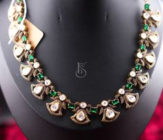 Simple yet elegant Victorian Necklace in emerald green stones with earrings which is perfect for cocktail parties and date nights. Green Emerald Kundan Necklace For Gift, Green Emerald Kundan Necklace As A Gift, Green Kundan Emerald Necklace For Gift, Green Kundan Necklace With Gemstone, Green Jewelry Sets With Stones For Party, Hand-set Emerald Necklace For Celebration, Celebration Hand-set Emerald Necklace, Elegant Emerald Gemstone Necklace For Party, Elegant Kundan Jewelry Sets With Stones