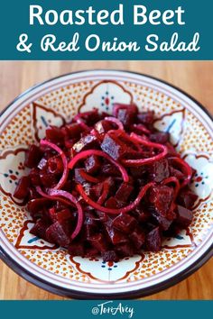 roasted beet and red onion salad in a bowl on a wooden table with text overlay