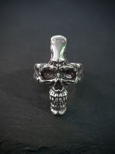 Unleash your inner rebel with our Cross Face Skull Ring, a striking and edgy piece of jewelry that's perfect for those who march to the beat of their own drum. Crafted with meticulous attention to detail, this ring combines elements of gothic and rock-inspired style to create a truly unique Jewelry. Add a touch of rebellion to your style with the Cross Face Skull Ring. It's not just a piece of jewelry; it's a statement of your distinctive personality and a conversation starter wherever you go. E Silver For Men, Gothic Skull, Skull Ring, Rings Statement, Everyday Look, Blue Sapphire, Favorite Jewelry, Stone Color, Antique Silver