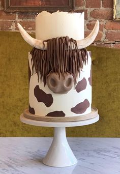 a cake decorated to look like a cow's head