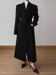 Classic style maxi coat with belted waist and collar. Contrast color under collar when turned up. Stunning slimline silhouette. Model is wearing MINUSEY S. ✔️ Free worldwide express shipping over $100✔️ Loved by 6,500+ customers✔️ Limited edition collections, maximum style⠀⠀⠀⠀⠀⠀⠀⠀⠀Stay ahead of the trend with can’t-find-anywhere-else staples. Your closet will thank you 💕 MINUSEY S = EU 34, US 2 MINUSEY M = EU 36, US 4 8% Angora / 70% Wool / 15% Polyester / 7% Nylon Dry clean Made in Korea - Model Height: 172cm/5'7" (US 2, EU 34) Black Wool Coat With Belted Cuffs For Winter, Black Wool Coat With Belted Cuffs For Work, Black Belted Wool Coat For Winter, Black Belted Wool Coat For Fall, Belted Long Formal Outerwear, Black Formal Outerwear With Belt, Long Belted Outerwear For Formal Occasions, Belted Long Outerwear For Formal Occasions, Black Belted Outerwear For Formal Occasions