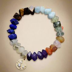 Flow Chakra Crystals Bracelet Stretchable Find your flow with our Chakra Crystals Bracelet. Lovingly handmade by a select group of artisans, this stretchable bracelet features carefully chosen chakra crystals that promote balance and harmony. Perfect for meditation, yoga, or daily wear, this bracelet combines beauty with functionality, fitting comfortably on any wrist. Features: Stretchable design for a perfect fit Seven chakra-aligning crystals Unisex style suitable for everyone Elevate your spiritual practice with this elegant piece. Details: Chakra Stones: Amethyst, Lapis, amazonite, jade, tiger eye, agate, and quartz Size: Approx 7.5 inches. 18-18.5cm Stretchable Handcrafted with love and care Click to see our entire Collection of > 7 chakra bracelets Bracelets Bracelet Care: To prolon Bracelet Apple Watch, Les Chakras, Protection Bracelet, Chakra Bracelet, 7 Chakras, Meditation Yoga, Mala Necklace, Leather Cuffs Bracelet, Chakra Crystals