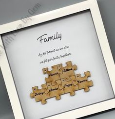 a wooden puzzle frame with the words family on it