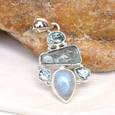 Natural Multi gemstone Pendant, Handmade 925 Sterling Silver gemstone Pendant Necklace, One of Kind Handmade Jewelry. Metal/Material: 925 Silver SKU: U492 Gemstone: Moonstone, Aquamarine, Blue Topaz Stone size: 10x14, 10x18 7, 5x7, 6x8, 5 mm approx. Weight: 9.5 gram approx. Stone Cut: Raw gemstone, Cut gemstone, Cab stone Stone Shape: Pear, Fancy, Round, Oval Stone Setting: Bezel Stone Color: Blue Finishing: Shiny Polished Gemstone Properties: A natural gemstone is a mineral, stone, or organic m Blue Moonstone Jewelry With Stones, Blue Topaz Gemstones With Gemstone Accents For Gift, Unique Blue Topaz Jewelry With Natural Stones, Silver Apatite Jewelry For Anniversary, Sterling Silver Sapphire Gemstones, Sterling Silver Sapphire Gemstones With Accents, Unique Blue Topaz Gemstone Jewelry, Sapphire Gemstones With Sterling Silver, Blue Multi-stone Gemstone Pendant