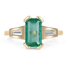 Featured is a stunning Colombian emerald and diamond, three-stone ring. A full 1.90-carats of pure, natural, Colombian beauty! This emerald displays a gorgeous, spring green color, with excellent eye clarity. On either side of this beauty, are tapered baguette accents that are bezel set. This unique ring was crafted in gleaming, 14K yellow gold. Setting Style: Three-Stone / Prong-Bezel Setting Material: 14K Yellow Gold Gold Weight: 3.1 Grams Main Stone: Emerald Shape: Emerald Cut Weight: 1.90-Ca Spring Green Color, Diamond Three Stone Ring, Baguette Diamond Ring, Baguette Diamond Rings, Colombian Emeralds, Yellow Gold Setting, Unique Ring, 14k Gold Ring, Three Stone Rings