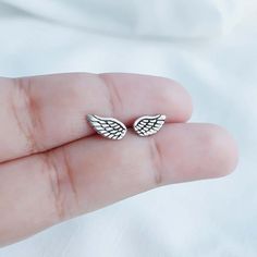 Real 925 Sterling Silver Dainty Angel Wings Stud EarringsThese lovely earrings can be used in Earlobe, Tragus and Cartilage.Measures 11 x 5mmComes with pushback backingsSold by PairJewelry will come in a gift box* Please read shop policy before placing an order **JEWELRY CARE*Sterling Silver will tarnish over time, but to help keep your jewelry looking beautiful - Clean with a soft dry cloth after wear and store inside an airtight bag or container.Remember to remove your jewelry when:• Applying Handmade Silver Wing-shaped Earrings, Silver Drop Cartilage Earrings As Gift, Silver Cartilage Earrings As Gift, Wing-shaped Earrings For Gift, Wing-shaped Pierced Earrings As Gift, Wing-shaped Pierced Earrings For Gift, Silver Sterling Cartilage Earrings Gift, Silver Sterling Silver Cartilage Earrings Gift, Gift Silver Sterling Silver Cartilage Earrings