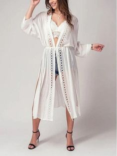 Add a touch of boho chic to your wardrobe with this kimono style cardigan. The front lace detail adds a touch of femininity and the long, flowy fit is perfect for a day at the beach or pool. This versatile piece can be worn as a cover up for your swimsuit, or as a festive addition to your outfit for a spring or summer party. Take it on your next resort vacation for a touch of bohemian flair. This kimono cardigan is the ultimate beach boho accessory Small (2/4), Medium (6/8), Large (10) Maxi Card Flowy V-neck Cardigan For The Beach, Chic Beach Cover-up Cardigan For Beach Season, Bohemian Lace Patchwork Summer Cover-up, Lace Open Front Cover-up For Summer, Spring Beach Party Cover-up With Crochet Trim, Chic Lace Cover-up For Beach Season, Chic Lace Trim Beach Cover-up, Hippie Style Cover-up For Spring Beach Party, Chic V-neck Festival Cover-up