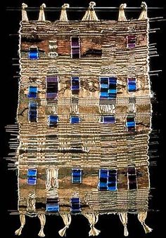 an image of a building made out of sticks and blue glass windows on black background