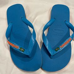 Brand New Beautiful Blue And Orange Flip Flops. Great For The Pool! Mens 9 Women’s 11 Really Unisex Blue Sporty Flip Flops For Vacation, Sporty Blue Flip Flops For Vacation, Casual Blue Flip Flops, Casual Blue Flat Flip Flops, Orange Flat Flip Flops Casual Style, Sporty Blue Flip Flops With Round Toe, Orange Casual Flat Flip Flops, Casual Orange Flat Flip Flops, Blue Slip-on Casual Flip Flops