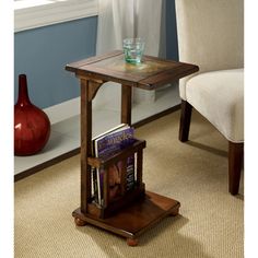 a table with a magazine rack on it in front of a chair and an apple