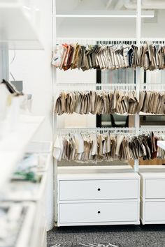 an organized closet with drawers and file cabinets