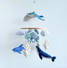 a mobile with sea animals hanging from it's sides