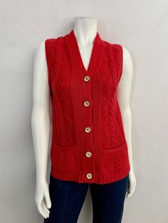 "Vintage 70's Boho, Virgin Wool, Sleeveless, Cardigan (S) This Ladies 70's Cardigan comes in a Red-Orange Virgin Wool and is Sleeveless with a Deep V Neckline and has Five Front Button Closure with Two Front Pockets and has a Cable Knit Weave. 100% Virgin Wool Made in Hong Kong *This Cardigan Sweater is in Excellent Condition. Size: (S) Modern Day 4 Bust: 34\"-36\" Length: 26\" Shoulder to Shoulder: 14\" (outside edges) Weight: 15 oz *Follow FreshandSwanky on Instagram" Orange Sleeveless Winter Vest, Winter Orange Sleeveless Vest, Orange Sleeveless Top For Winter, Vintage Sweater Vest For Fall, Retro Red Sleeveless Vest, Red Sleeveless Retro Vest, Vintage Sleeveless Sweater Vest For Fall, Vintage Red Sweater Vest For Fall, Red Vintage Sweater Vest For Fall