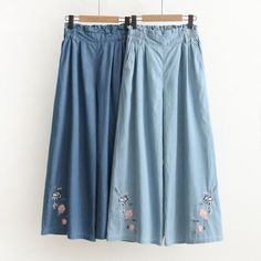 High Waist Embroidered Blue Pants, Blue Embroidered High Waist Pants, Spring Embroidered Denim Blue Pants, Embroidered Wide Leg Denim Blue Pants, Casual Embroidered Denim Blue Bottoms, Embroidered Denim Blue Casual Bottoms, Denim Blue Floral Embroidery Wide Leg Jeans, Wide Leg Denim Blue Jeans With Floral Embroidery, Embroidered Denim Blue Pants