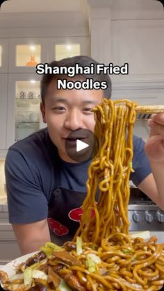 a man is eating noodles with chopsticks in his mouth and the caption reads, shanghai fried noodles