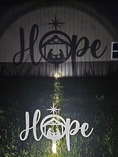 the word hope is lit up in the grass