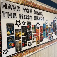 a bulletin board with many different books on it