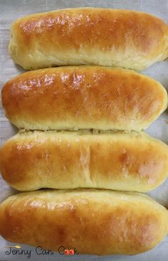 four loaves of bread sitting on top of each other