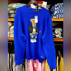 New With Tag Designer Blue Sweater For Winter, Designer Blue Sweater For Fall, Designer Long Sleeve Blue Sweater, Designer Blue Long Sleeve Sweater, Luxury Blue Long Sleeve Sweater, Bear Ralph Lauren Sweater, Polo Ralph Lauren Flag Sweater, Ralph Lauren Bear Sweater, Ralph Lauren Quarter Zip