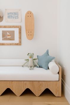 a white day bed with a stuffed animal on it