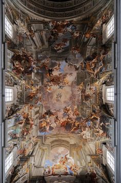 an ornate ceiling with many paintings on it