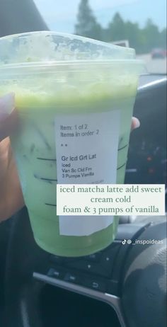 a person holding up a green drink in their hand with the caption iced matcha latte and sweet cream cold foam & 3 pumps of vanilla