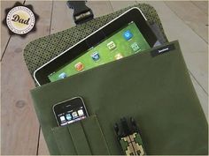 an ipad and cell phone in a green bag