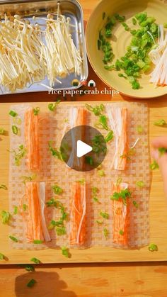 an overhead view of food being prepared on a cutting board with chopsticks and vegetables