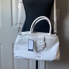 Style Nyn50i806 One Big Zipper Pocket In The Middle Two Pockets For Cards And An Extra Zipper Pocket In The Other Side 8” Tall. 13” Bottom White Satchel With Adjustable Strap For Work, White Bags For Workwear In Spring, White Spring Bags For Workwear, White Bags For Workwear And Spring, White Satchel With Detachable Strap For Work, White Shoulder Bag With Zipper For Work, White Bag With Adjustable Strap For Work, White Satchel Shoulder Bag For Work, White Shoulder Satchel For Work