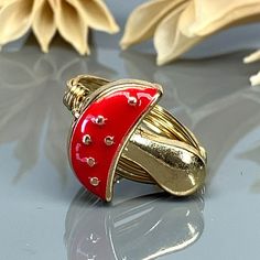 Red Enamel Mushroom Ring- Sterling Silver, Yellow or Rose Gold Filled Wire & Gold Tone Zinc Alloy Bead -Size 4 5 6 7 8 9 10 11 12 13 14 *This mushroom bead and wire wrapped ring is handmade with an approximately 17mm x 15mm gold tone zinc alloy bead and your choice of wire type for the band. *This can be a two toned ring as the bead remains gold in color regardless of the wire band color/metal type you select for the band. *This ring (as well as all the others in my shop) is custom made to any s Adjustable Gold Whimsical Rings, Whimsical Adjustable Gold Rings, Red Mushroom Design Jewelry Gift, Adjustable Red Enamel Rings, Mushroom Ring, Argentium Silver, Wire Wrapped Rings, Beads And Wire, Silver Rose Gold