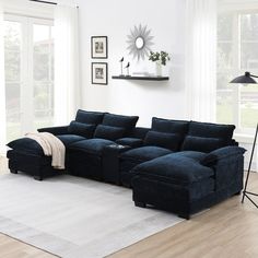 a living room with a large blue sectional couch