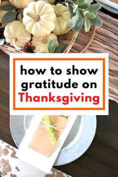 a thanksgiving table setting with white pumpkins and greenery in the center, text overlay reads how to show gratitude on thanksgiving