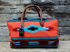 "Handcrafted, Functional and stunning . 100% Leather handles + protective corners and Handwoven Wool. This eye catching weekender is meant for getaways. The southwestern boho design and our top grain leather stands out in a crowd and is sure to be show stopper. Perfect carry on or weekend get away bag. Dimensions: 21\" x 11\" x 11\" (carry-on friendly) Exterior- Handles Made From 100% Top Grain Leather Body Is 100% Handwoven Wool Built Tough With Top Carry Handles 4 Feet To Keep Bottom Clean Our Bohemian Rectangular Bag For Overnight Trips, Southwestern Multicolor Bags For Everyday Use, Southwestern Style Tote Bag For Everyday Use, Multicolor Southwestern Bags For Everyday Use, Southwestern Style Everyday Tote Bag, Southwestern Multicolor Everyday Bags, Multicolor Southwestern Style Everyday Bags, Multicolor Southwestern Everyday Bags, Southwestern Style Rectangular Bag For Everyday Use