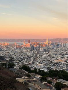 a view of a city from the top of a hill