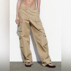 -Taupe Brown -Unworn -New With Tags Brown Straight Cargo Pants For Summer, Beige Cargo Bottoms For Fall, Beige Cargo Pants For Fall, Beige Cargo Style Parachute Pants For Fall, Spring Brown Full-length Cargo Pants, Beige Utility Trousers, Brown Summer Cargo Pants, Baggy Beige Wide Leg Pants With Cargo Pockets, Brown Cargo Style Bottoms For Spring