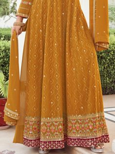 Introducing our exquisite mustard yellow gown ensemble, perfect for your special haldi function. This elegantly crafted dress comes with a matching mustard-colour bottom and a coordinating dupatta, providing a vibrant and immersive hue of color.
One of the key benefits of our gown ensemble is its exceptional comfort combined with style. Made from the soft, flowing fabric of georgette, the gown ensures that you not only look stunning but also feel at ease throughout the event. The bottom piece is Semi-stitched Orange Dress With Intricate Embroidery, Yellow Sharara With Straight Kurta For Wedding, Yellow Maxi Length Kurta For Diwali, Yellow Maxi-length Kurta For Diwali, Yellow Floor-length Kurta With Zari Work, Yellow Traditional Drape Gown, Yellow Floor-length Salwar Kameez With Intricate Embroidery, Floor-length Yellow Salwar Kameez With Intricate Embroidery, Yellow Chikankari Embroidered Floor-length Lehenga