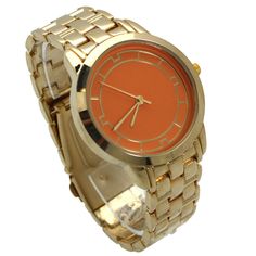 This Gold and Solid Color Face Watch from Olivia Pratt is super unique and vibrant, featuring a gold metal strap, colorful accented case, and classy numeral ticks. This watch is the perfect addition to your accessory collection. Olivia Pratt is always looking after new designs to improve your style! Using the best quality materials available in all of our products to ensure long durability in your every day wear. Please be aware, color vibrancy of the product might change from device to device. Trendy Gold Watches With Metal Dial, Trendy Gold Metal Watch Accessories, Trendy Gold Metal Watches, Improve Your Style, Metal Straps, New Designs, Orange Gold, Ticks, Womens Watches