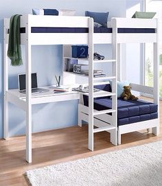 a young boy standing in front of a bunk bed with a basketball on the floor