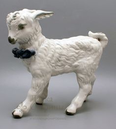 a figurine of a dog with a bow tie on it's neck