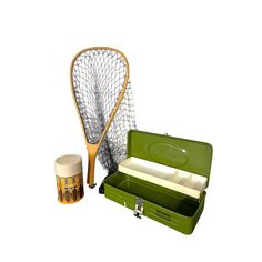 a green case with two tennis racquets in it and another item next to it