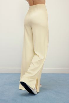 Slip into our cozy Ribbed Wide Leg Pants and enjoy a relaxed fit that will keep you warm and comfy all season long. The flared leg with side slits add freedom of movement and a fashion-forward finish! Details Materials & Care Shipping & Returns • Features flared legs, elastic waistband, and side pockets.• Made from a ribbed blend of cotton and modal. Perfect for the early fall. Size M is 39.4" in length.• Pair with our matching Ribbed Drawstring Waist Top for a full cozy set! • Materials: 57% co Wide Leg Ribbed Pants, Cozy Full-length Bottoms With Ribbed Waistband, Cozy Full Length Bottoms With Ribbed Waistband, Wide Leg Beige Sweatpants For Winter, Cream Relaxed Fit Pants With Straight Hem, Winter Loungewear Bottoms With Straight Hem, Wide Leg Bottoms With Soft Texture, Wide Leg Loungewear Bottoms For Winter, Soft Texture Wide Leg Bottoms